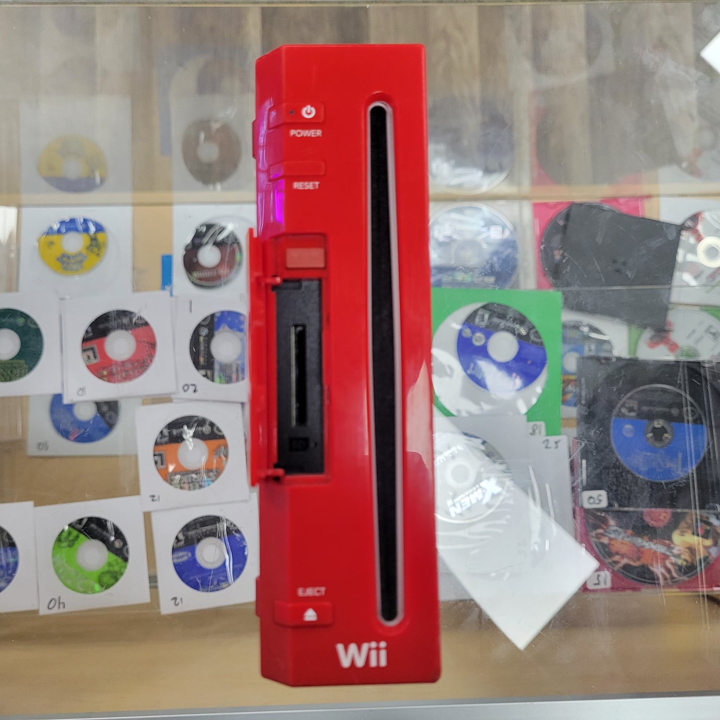 Red Nintendo Wii System with controllers and cables