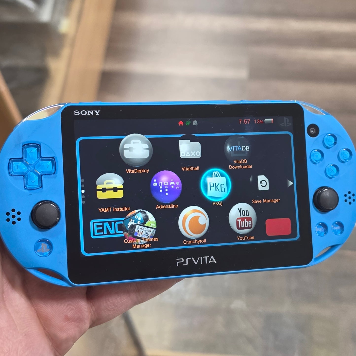 PlayStation Vita Slim Aqua Blue Handheld System with Charger (Has SD to Vita) (Digital Games)