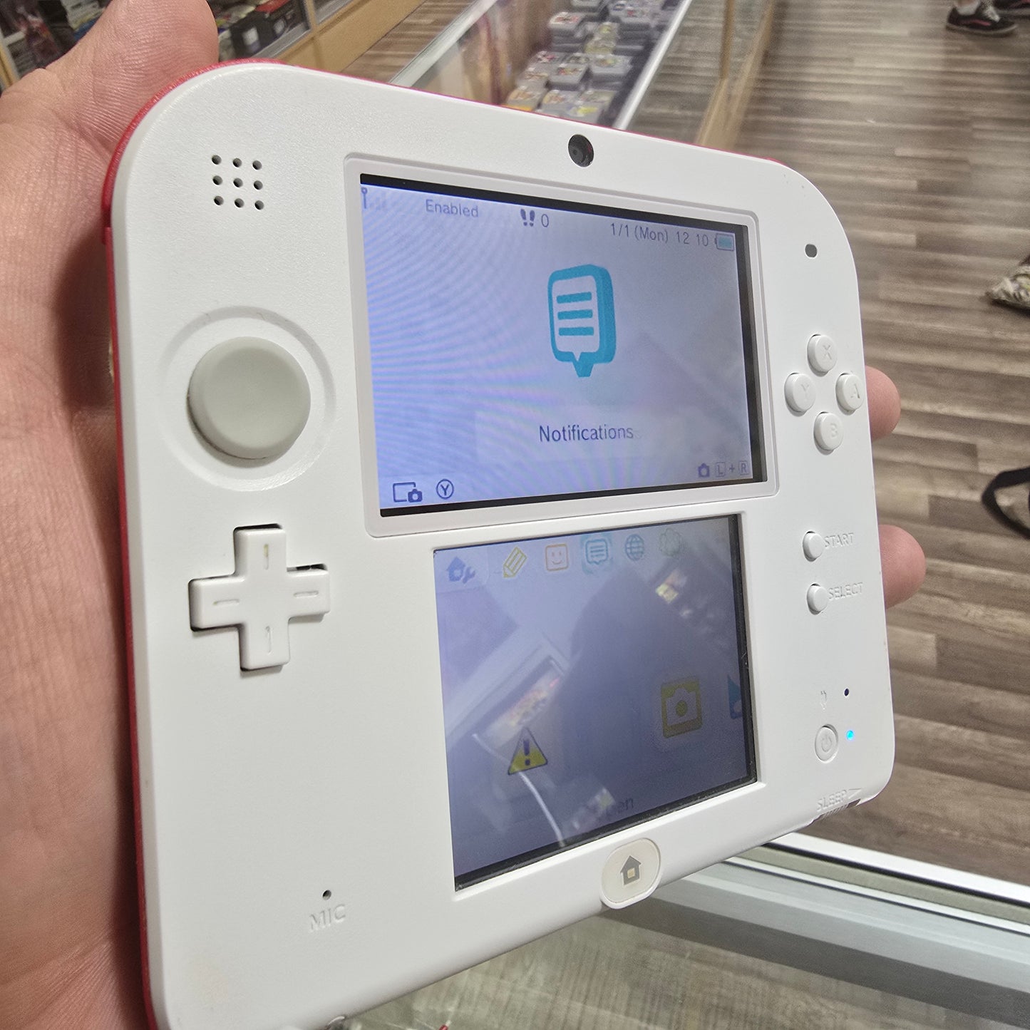 White and Red Nintendo 2DS Handheld System with Charger