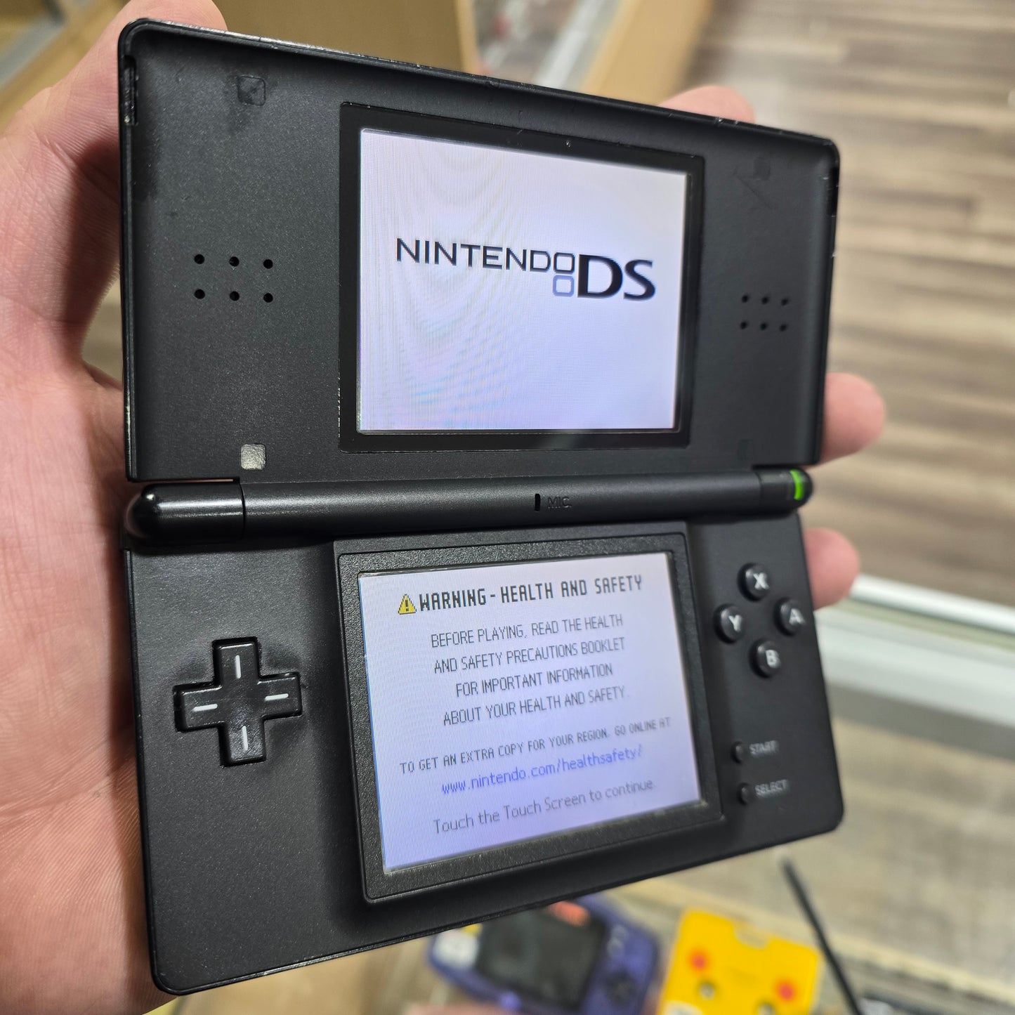 Black Nintendo DS Lite Handheld System with Charger (Has Screen Protector)