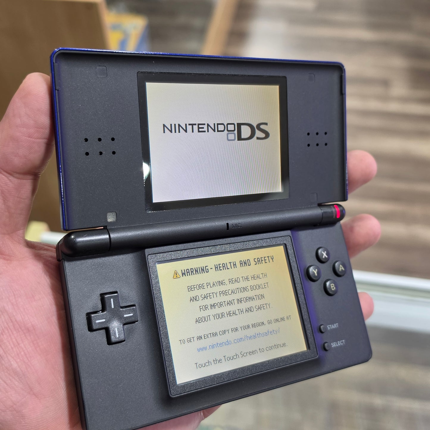 Blue Nintendo DS Lite Handheld System with Charger (Yellowish Bottom Screen)