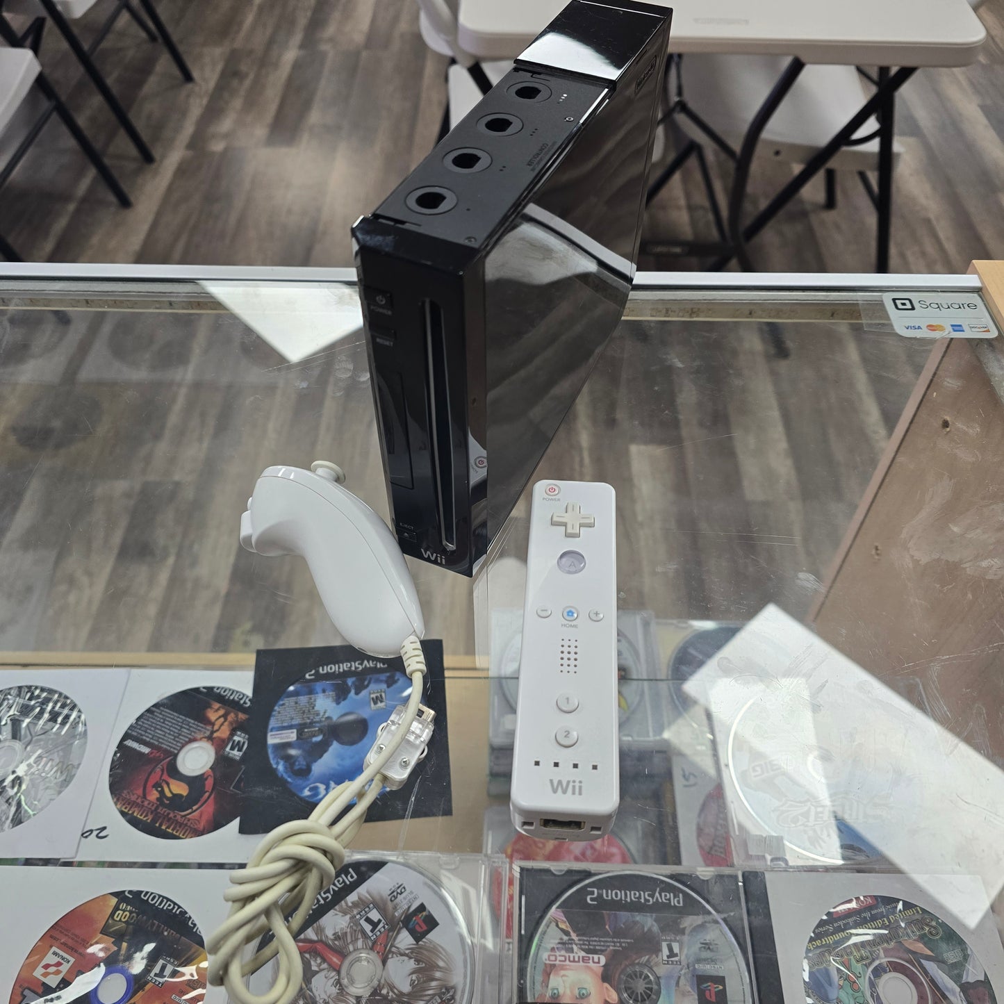 Black Nintendo Wii Console with Controllers and Wires