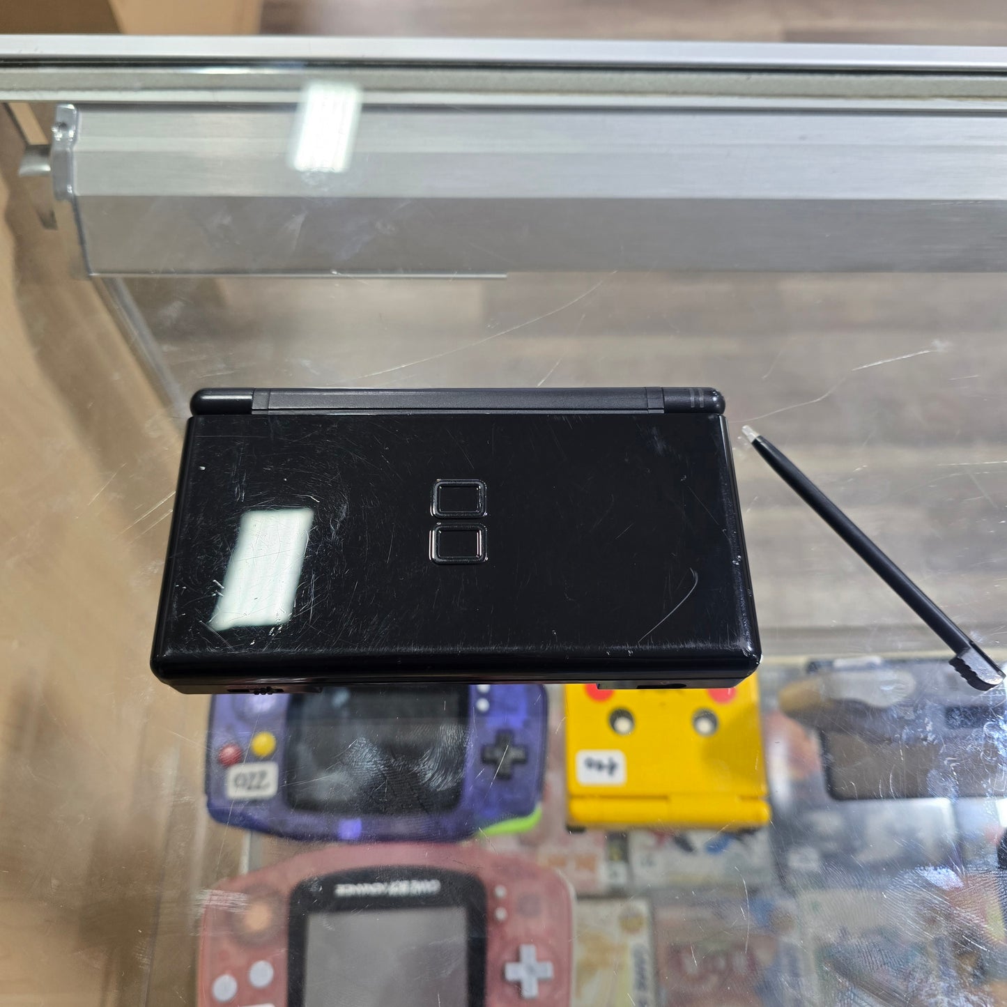 Black Nintendo DS Lite Handheld System with Charger (Has Screen Protector)