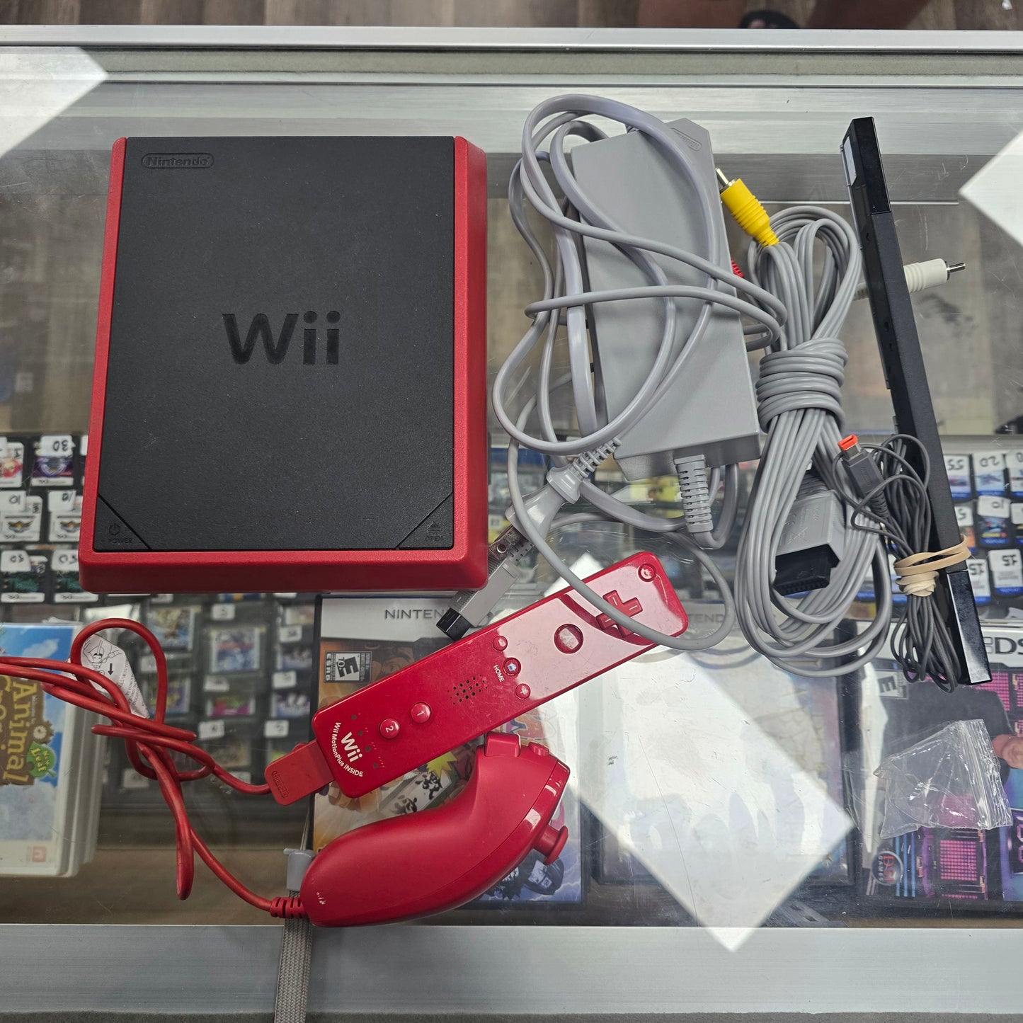 Red Nintendo Wii Mini System with Wires and Controllers