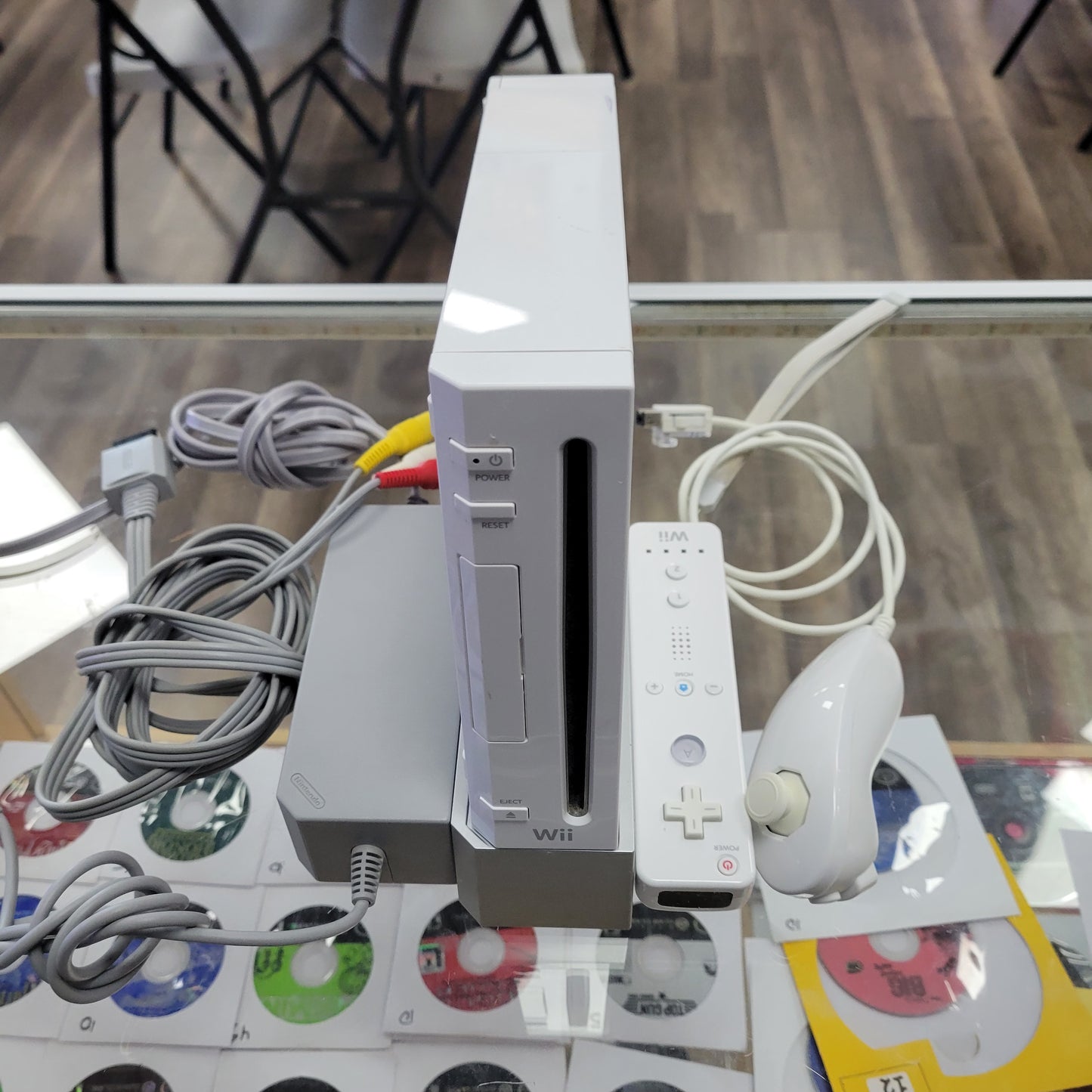 White Nintendo Wii System With Controllers and Wires