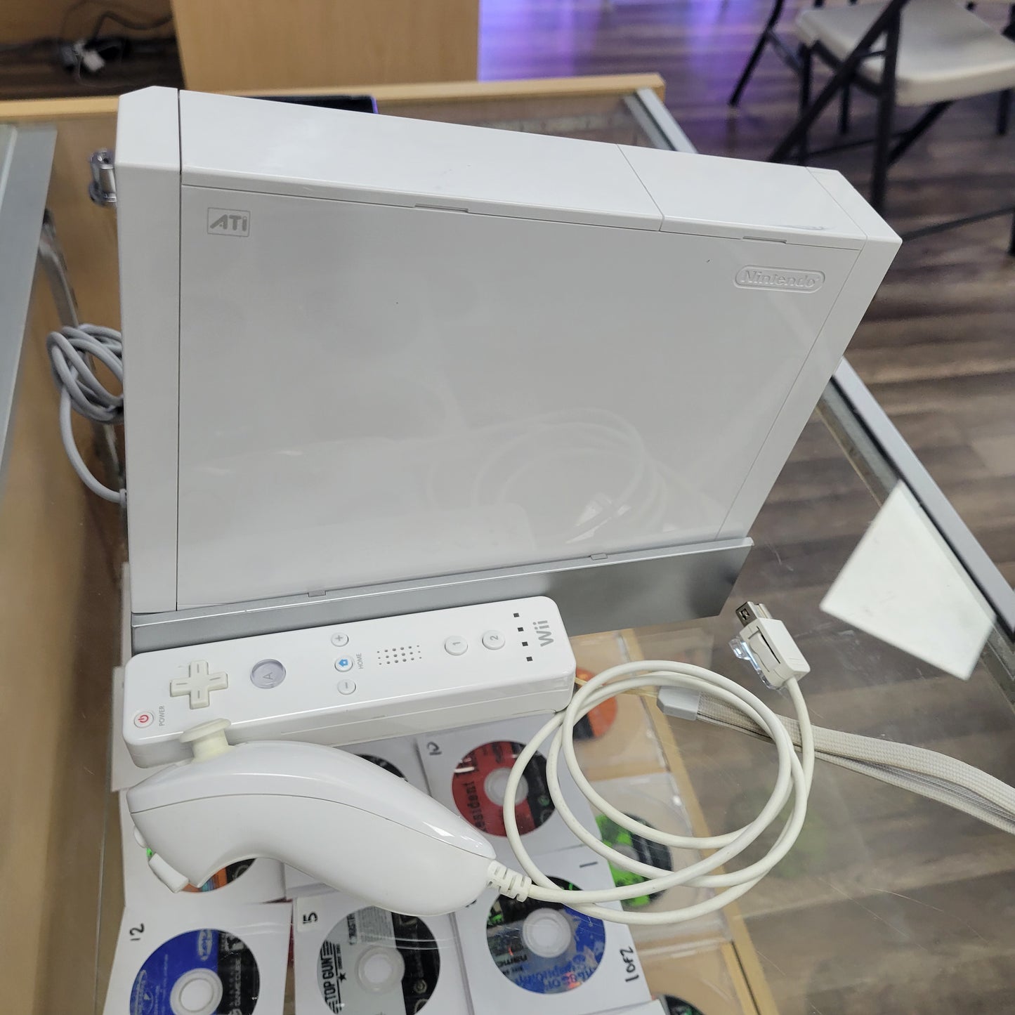 White Nintendo Wii System With Controllers and Wires