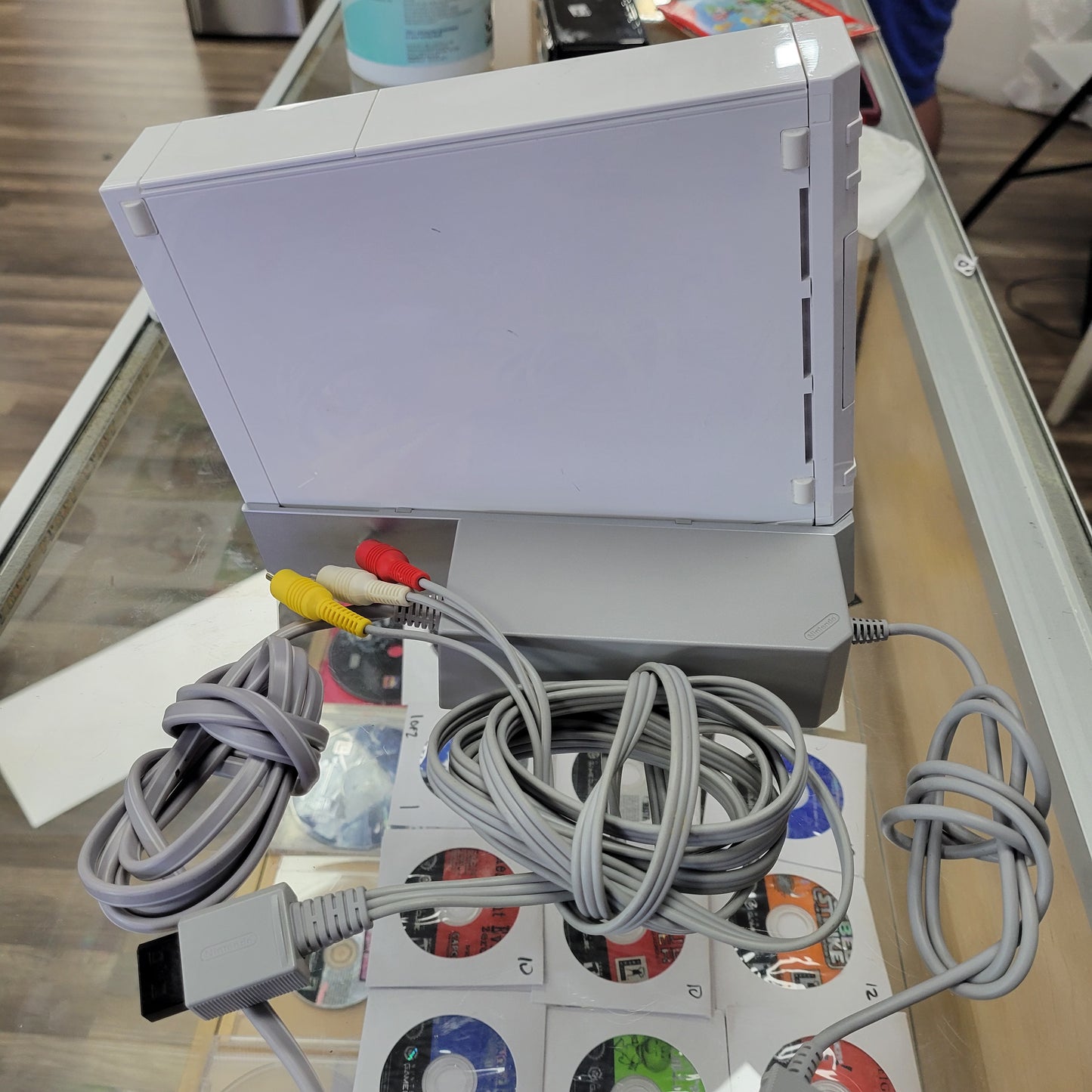 White Nintendo Wii System With Controllers and Wires