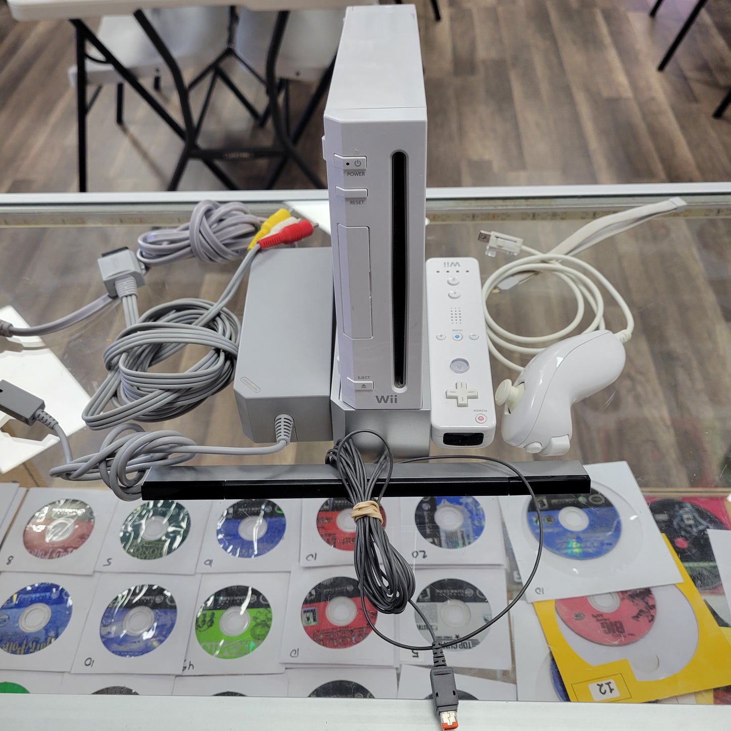 White Nintendo Wii System With Controllers and Wires