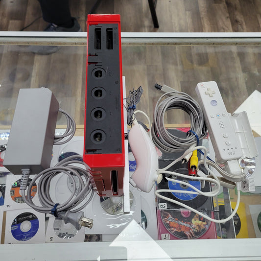 Red Nintendo Wii System with controllers and cables