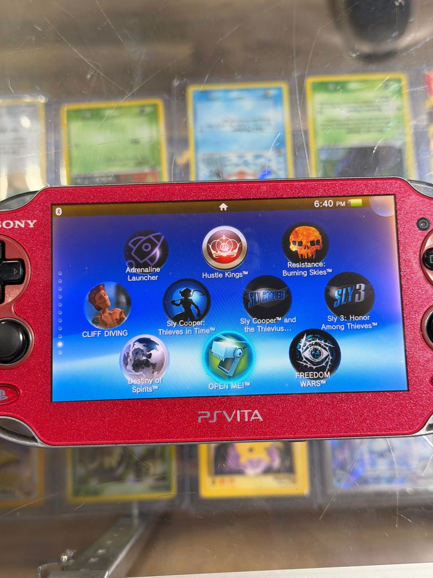 PlayStation Vita Red OLED Handheld System with Charger (Digital Games)