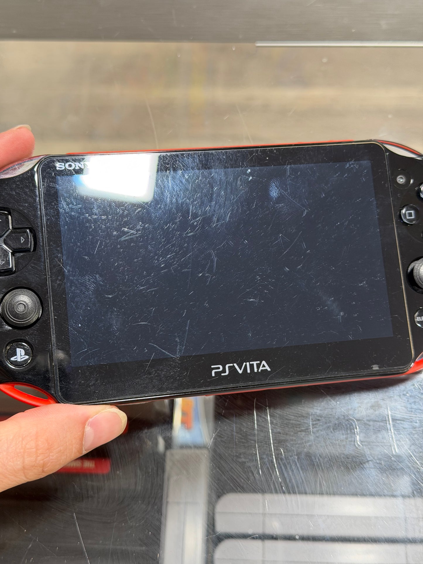 PS Vita - with Charger and Digital Games