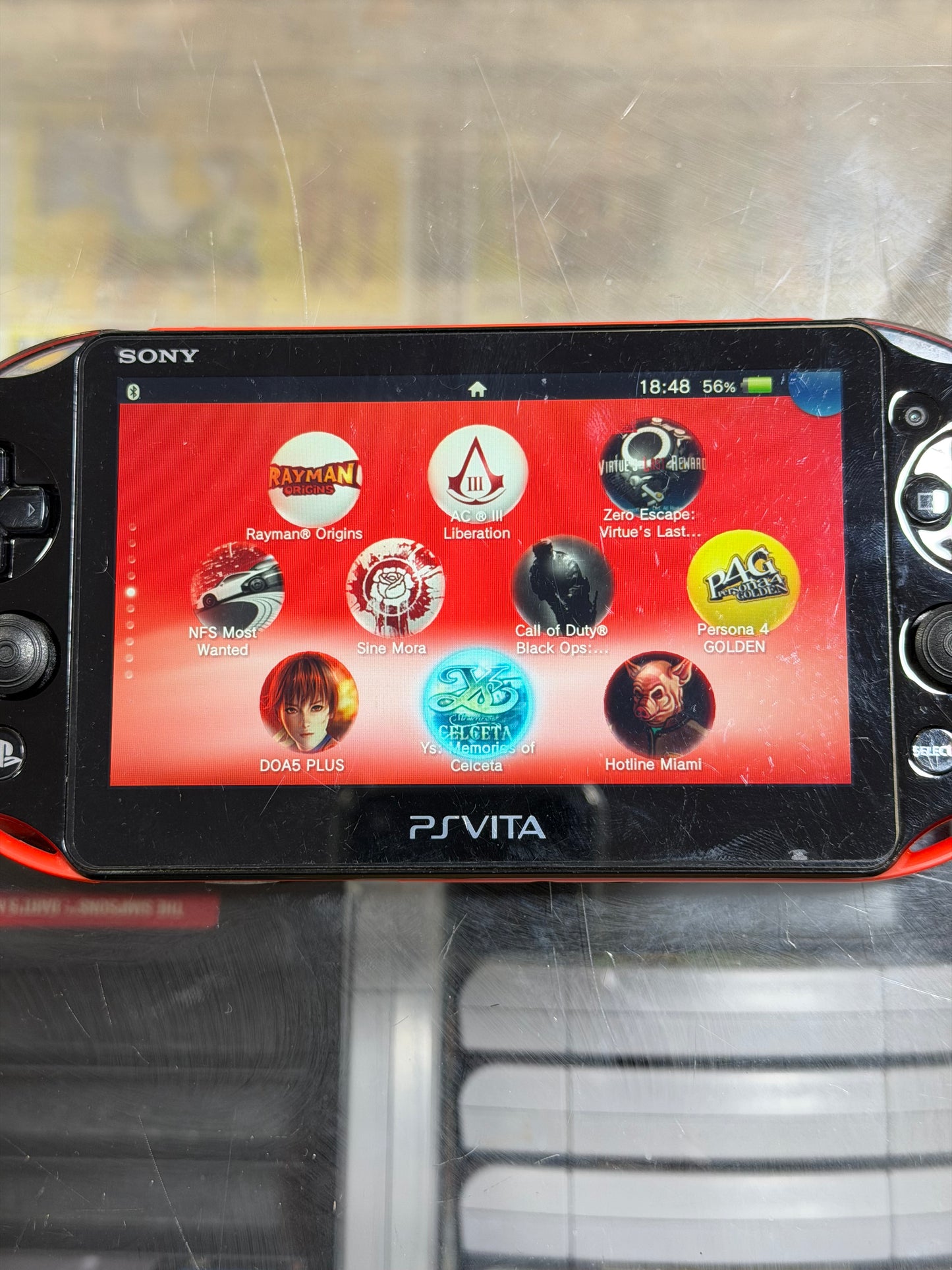 PS Vita - with Charger and Digital Games