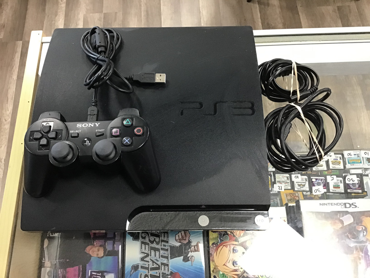 PlayStation 3 Slim System with wires and one controller