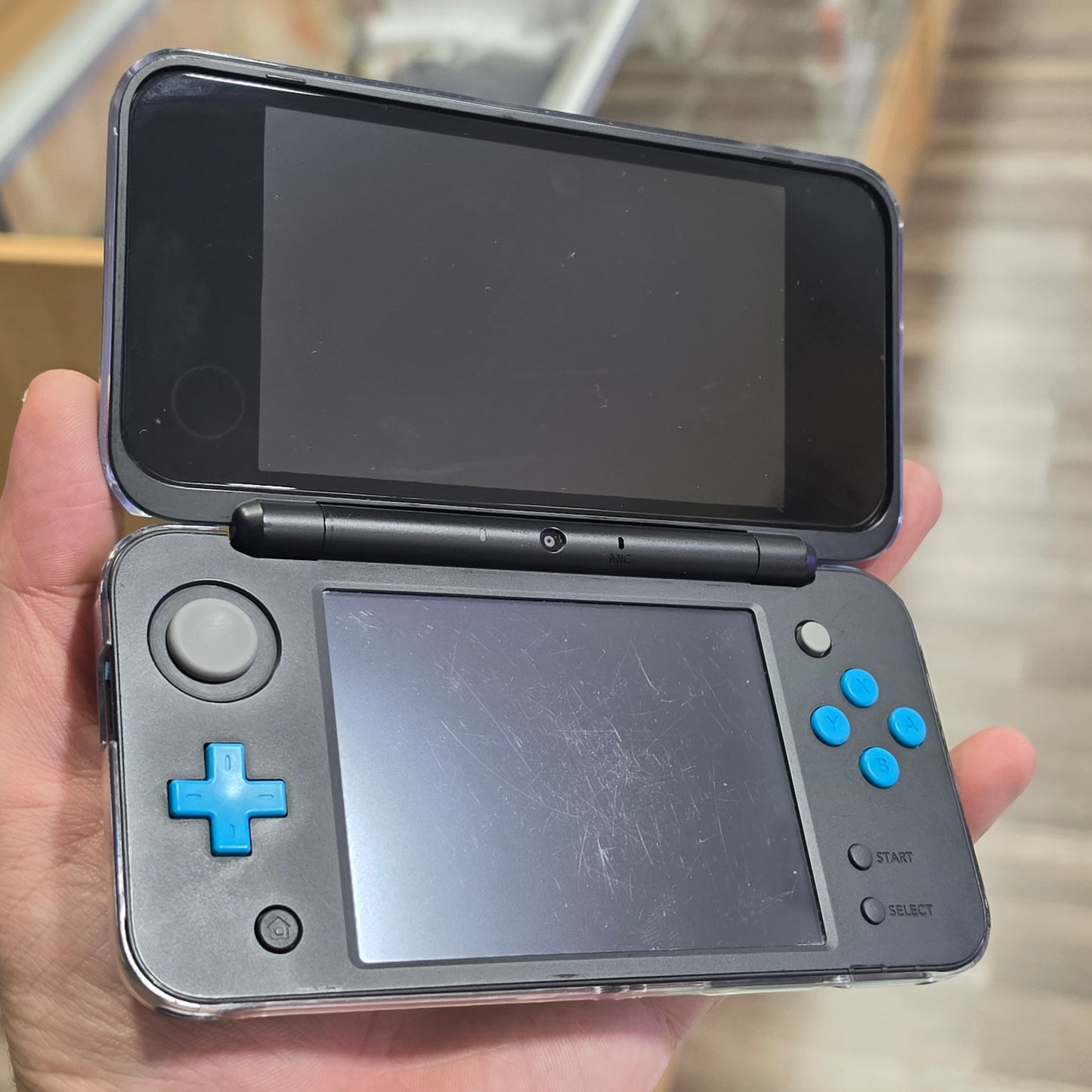 New Nintendo 2DS XL Black + Turquoise Handheld System with Charger (Digital Games)