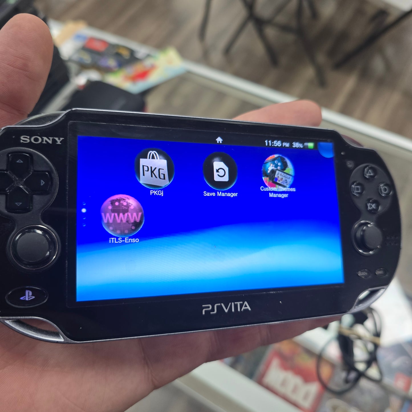 Playstation Vita Handheld System with Charger (Has Digital Games Loaded)
