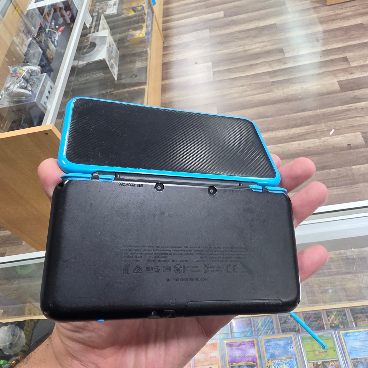 New Nintendo 2DS XL Black + Turquoise Handheld System with Charger (Digital Games)