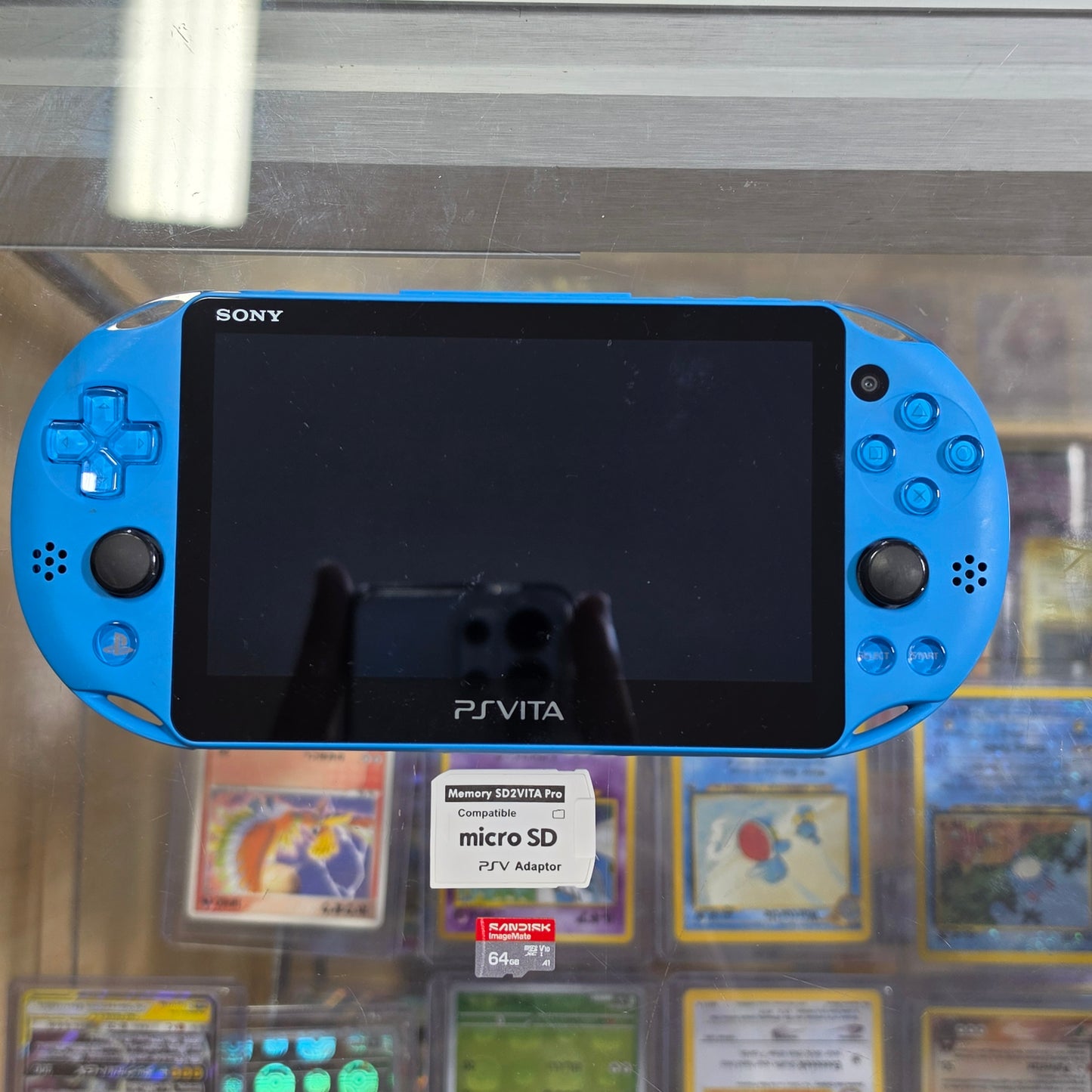 PlayStation Vita Slim Aqua Blue Handheld System with Charger (Has SD to Vita) (Digital Games)