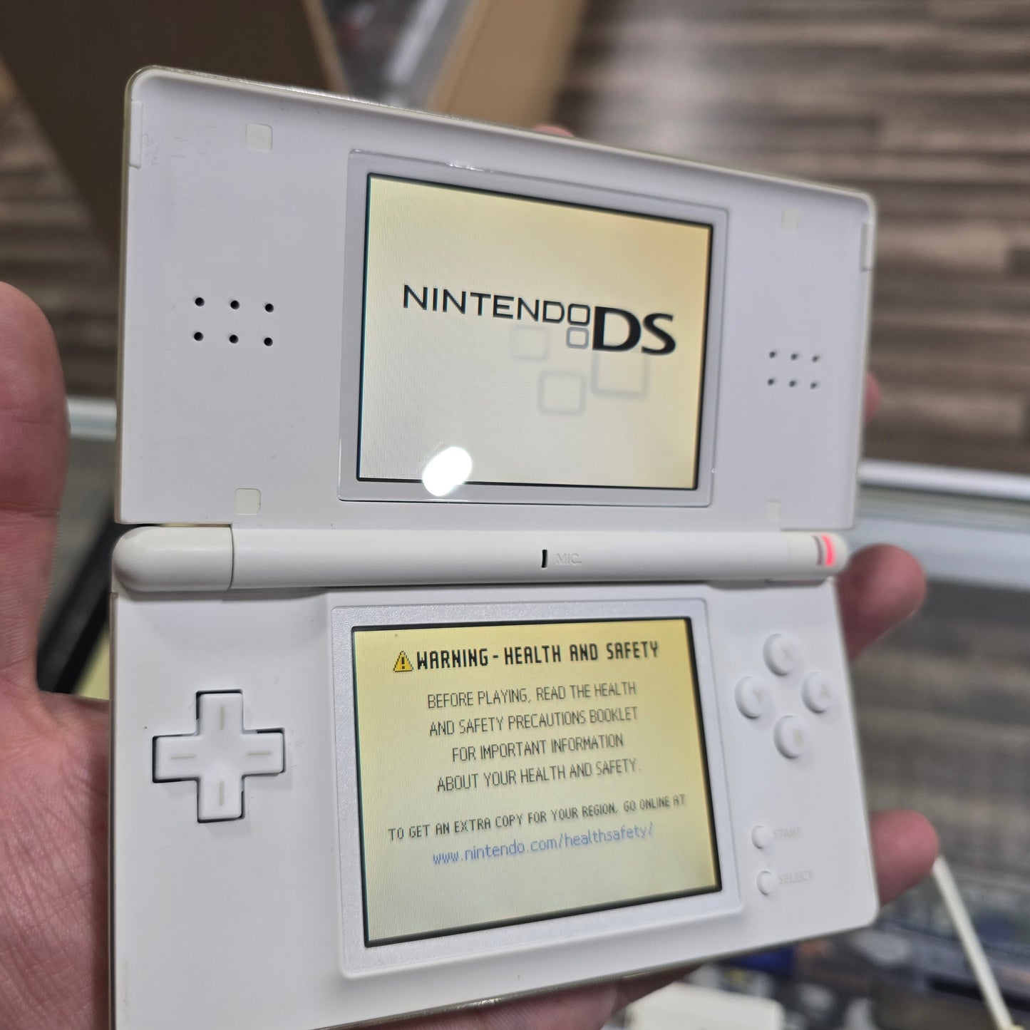 White Nintendo DS Lite Handheld System with Charger (Yellow Screen)