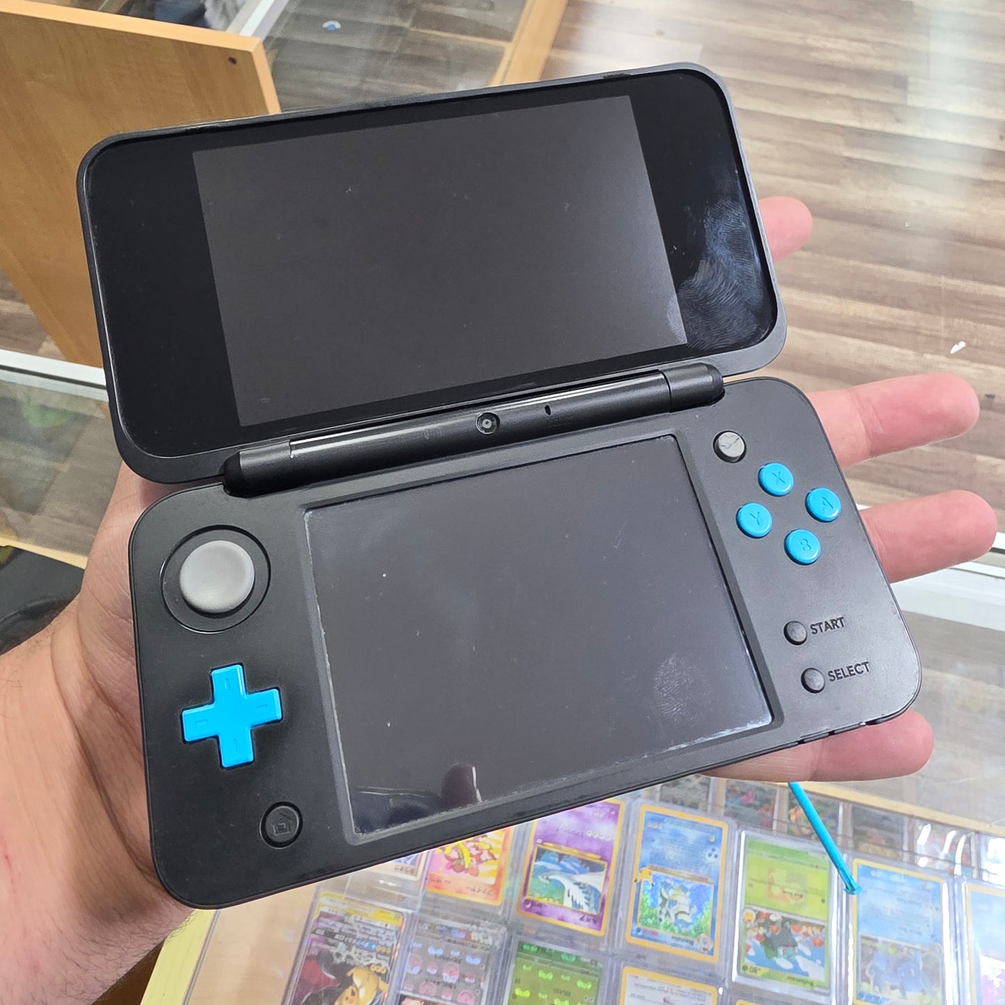 New Nintendo 2DS XL Black + Turquoise Handheld System with Charger (Digital Games)