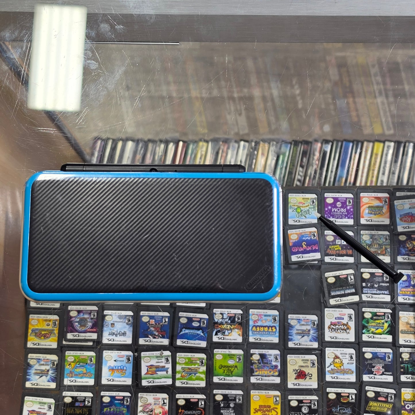 New Nintendo 2DS XL Black + Turquoise Handheld System with Charger (Digital Games)