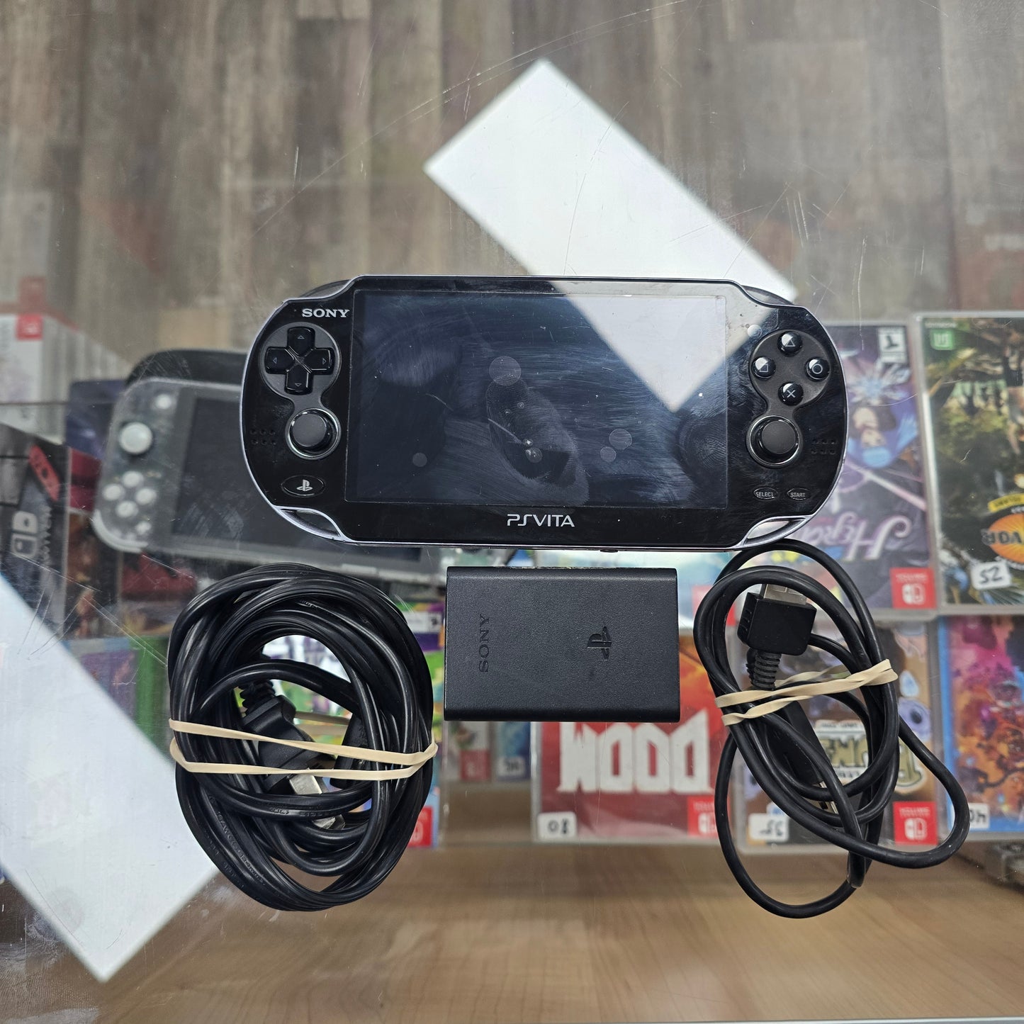 Playstation Vita Handheld System with Charger (Has Digital Games Loaded)