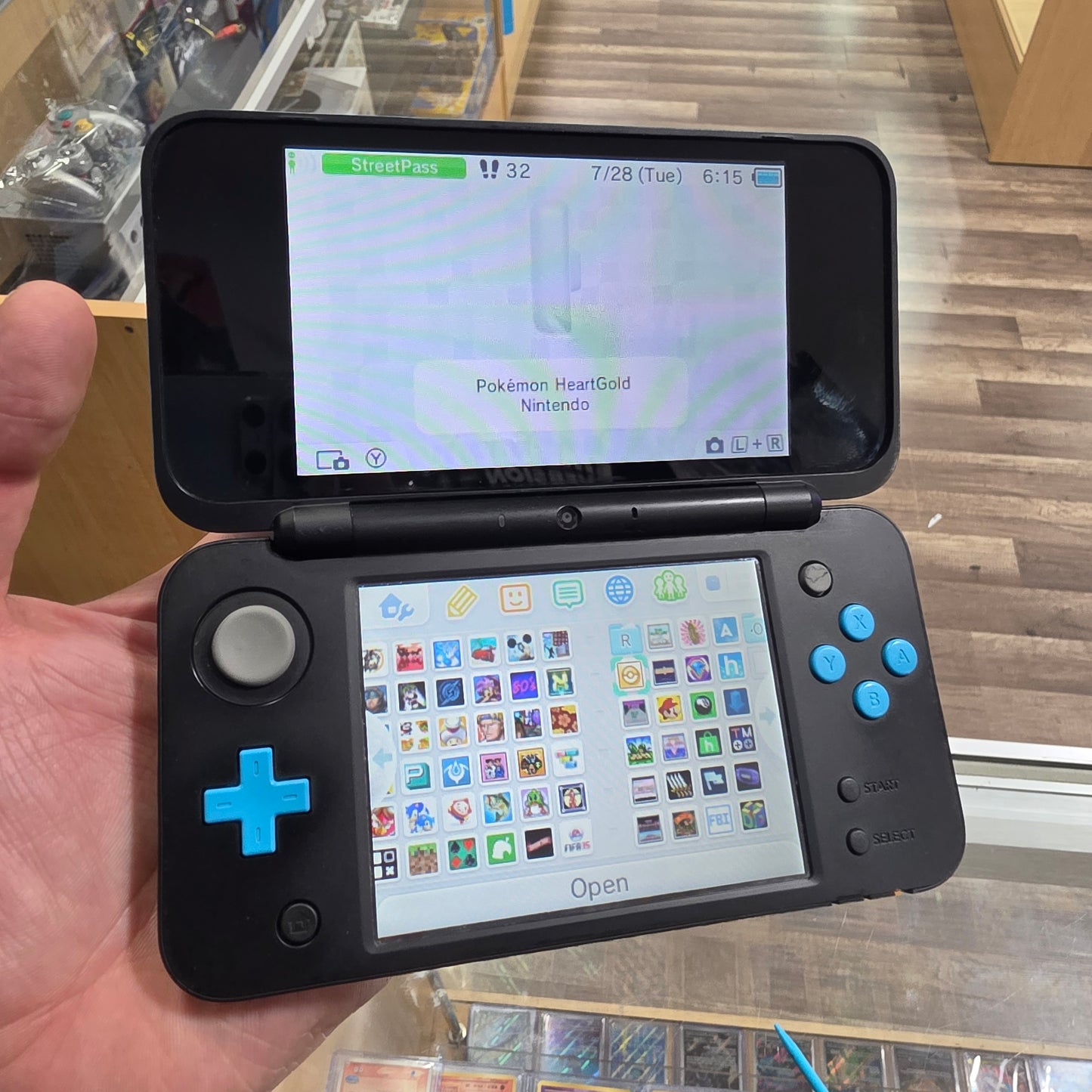 New Nintendo 2DS XL Black + Turquoise Handheld System with Charger (Digital Games)