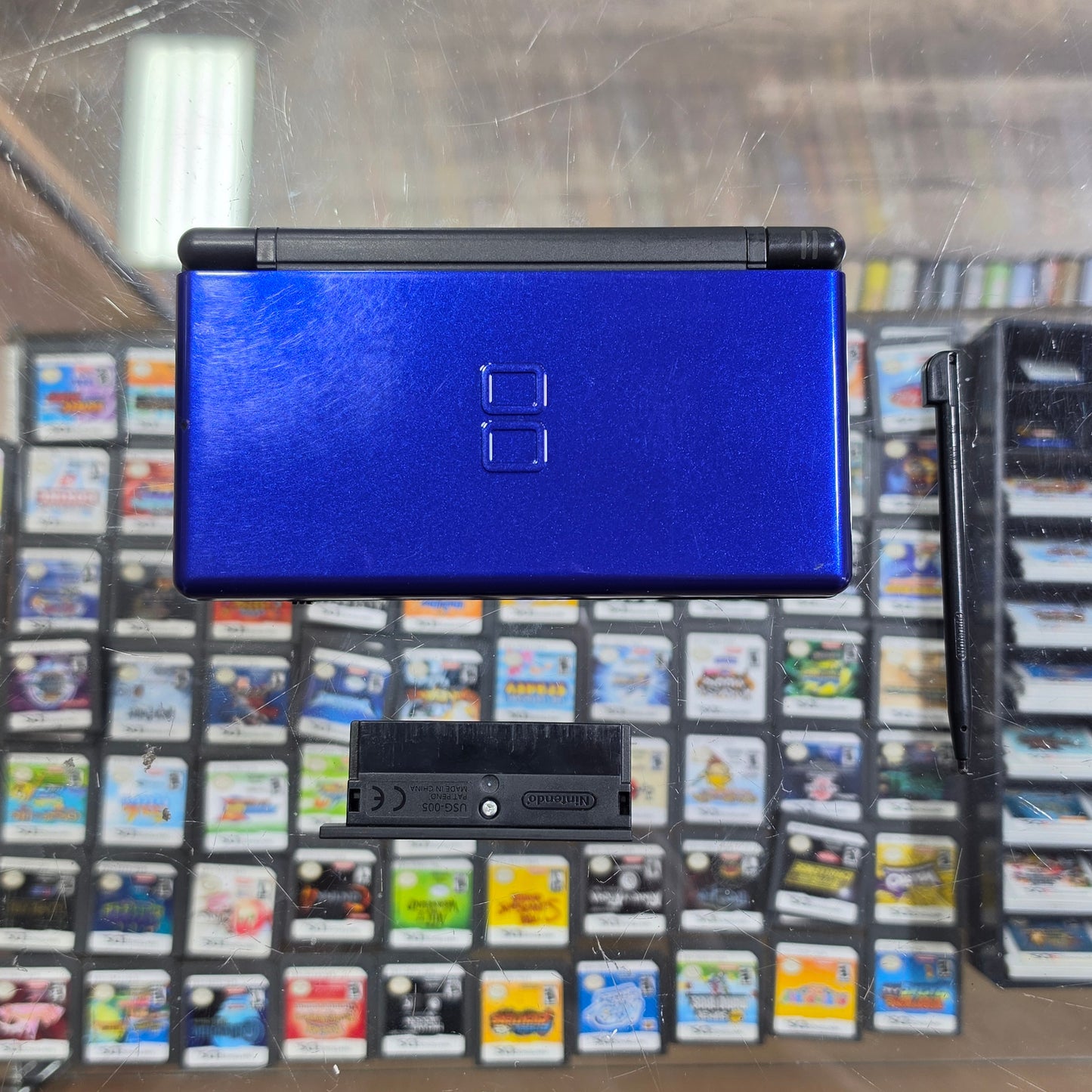 Blue Nintendo DS Lite Handheld System with Charger (Yellowish Bottom Screen)