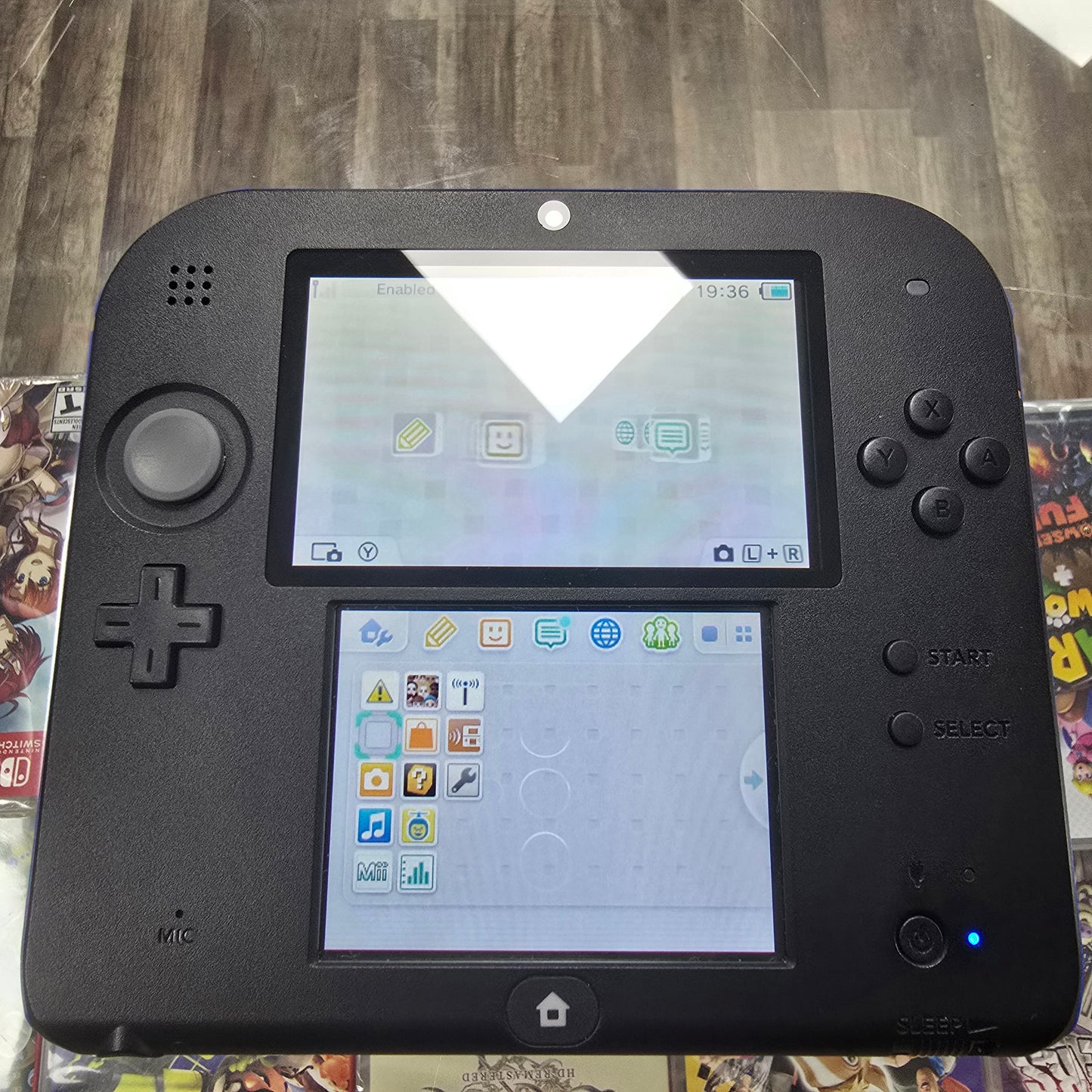 Blue and Black Nintendo 2DS Handheld System with Charger